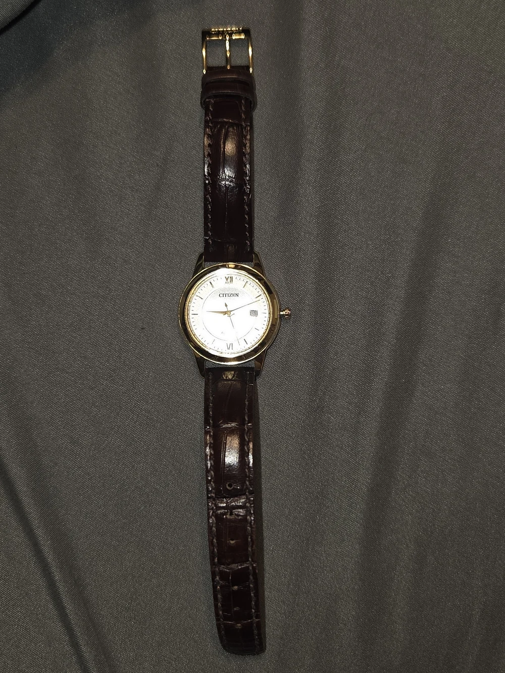 Citizen Gold Tone Case Watch with Brown Strap.